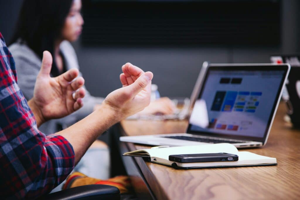 Business professionals in a meeting, discussing generative AI leader, and the importance of prompting to enhance decision-making processes